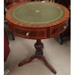 A reproduction mahogany drum table with circular inset top, on pedestal base