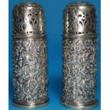 A pair of heavily embossed pepper pots, London 1901, 4.4oz