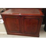 A mahogany reproduction 2 door stereo cabinet