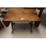 A dwarf sofa/coffee table in distressed crossbanded mahogany
