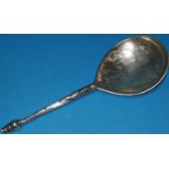 A white metal possibly 17th / 18th century teardrop shaped anointing spoon, with archtectural engra