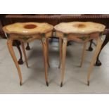 A pair of crossbanded burrwood occasional tables in the Louis XV style, with shaped oval tops and