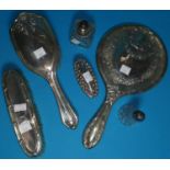 A two piece hallmarked backed brush and mirror set Chester 1914, a silver backed brush, a silver