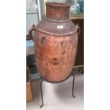 A large terracotta Grecian style amphora on stand (rim chipped)