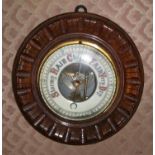 A mahogany cased aneroid barometer