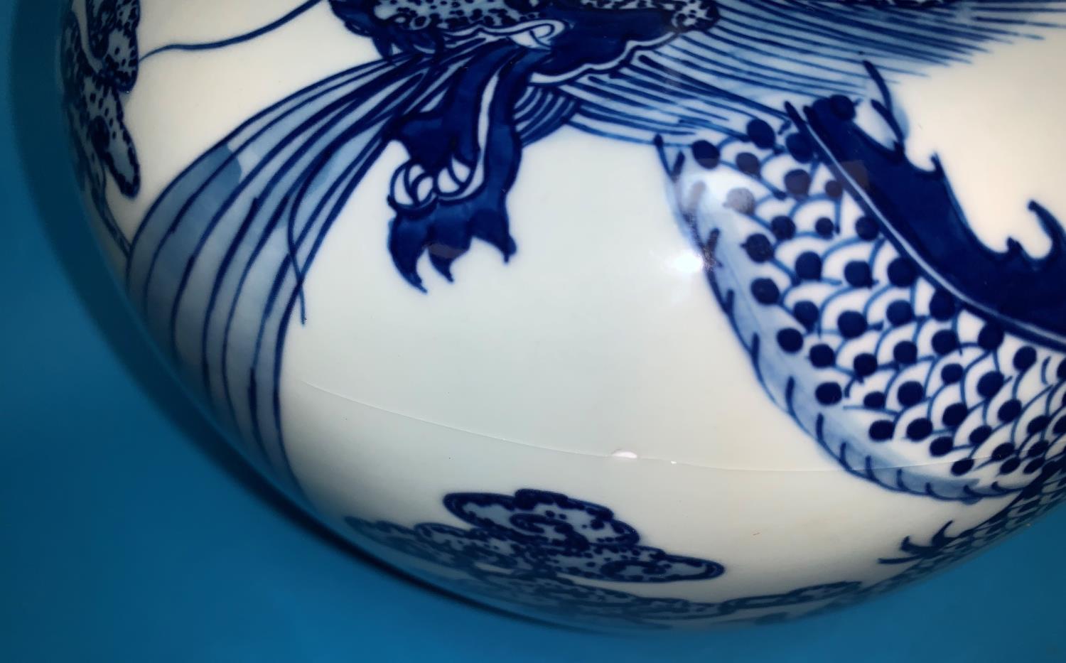 A Chinese pair of globular vases with underglaze blue decoration of dragons, 12" (one with - Image 3 of 4