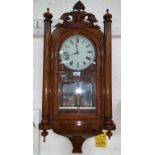 A 19th century American striking wall clock in inlaid walnut case