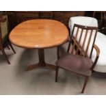 A pair of G-Plan teak carver chairs with slat backs; A G-Plan teak extending dining table with