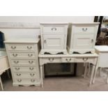 A modern bedroom suite in white comprising 6 height chest of drawers, side/dressing table, and 2