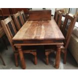 A Mediterranean style rustic dining suite comprising table and 6 matching chairs