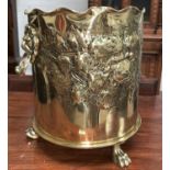 A WW1 'Trench Art' jardinière with lion mask and ring handles, relief trailing flower and leaf