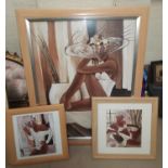 A modern framed print: reclining girl in white swimsuit and fancy hat; 2 similar prints