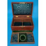 An Edwardian brown leather jewellery box by Finnigans, Manchester with gilt monogram, hinged lid and