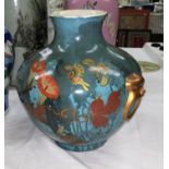 A hand painted Japanese studio pottery vase decorated with a drip glaze, flowers and butterflies etc