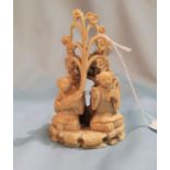 A 19th Century Ivory carving of people seated between trees etc 9.5cm