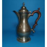 A Georgian style silver coffee pot, of baluster form with gadrooned border and circular foot,