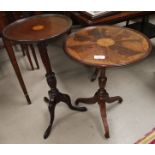 A mahogany inlaid dish top wine table on trefoil base on columns and a later reproduction wine table
