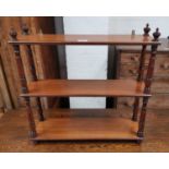 A late Victorian mahogany 2 height wall shelf with turned supports, width 24"