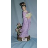 A 20th Century Chinese stoneware figure of a woman with fan bearing faint seal mark to the base,
