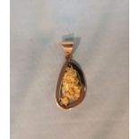 An African (Gabon) yellow metal nugget pendant, tests as 18 ct, 29.7 gm