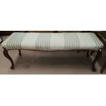 A Victorian walnut framed duet stool, on slender cabriole supports, 47"