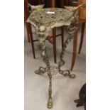 A brass two tier plant stand