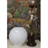 A 1930's Art Deco gilded metal table lamp depicting a dancing woman on marble base, with white globe