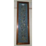 A Chinese silk embroidered sleeve panel, framed; a selection of Chinese ornaments