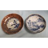 Two oriental blue and white dishes, one with brown glazed border