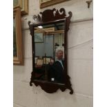 A late 19th/early 20th century wall mirror in Chippendale style fretwork frame