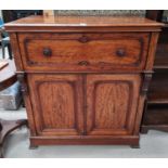 An early 19th century mahogany secretaire/cabinet with carved handles and mounts, fall front