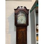 An early 19th century mahogany longcase clock with arched painted dial and 8 day movement