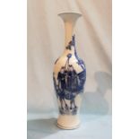 A 19th century Chinese slender baluster vase decorated in blue and white with animal figures, blue