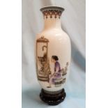 A Chinese Republic period baluster vase decorated in polychrome with a woman looking at a picture of