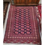 A 20th century Persian "Yahyali" rug, hand knotted, red ground with multiple-border to the field