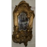 An Art Nouveau gilt wall mirror with cherubs and another