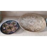 A large Chinese cream ground plate decorated with flowers, 36cm diameter and a Middle Eastern plate