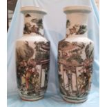 An early/mid 20th century Chinese pair of large rouleau vases, famille verte decoration with