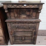 A 'Jacobethan' oak court cupboard of small size, carved lunette frieze, 33 in
