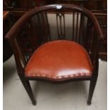 An Edwardian inlaid tub shaped armchair; a pair of cane seat bedroom chairs; a mahogany wine table