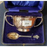 An Arts & Crafts silver porringer and spoon with planished decoration, Birmingham 1927, boxed