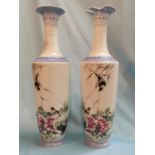 A Chinese Republic pair of slender tapering vases decorated in the famille rose manner with birds