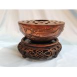 A Newlyn circular copper bowl with flower separator, planished and decorated with fish, etc.,