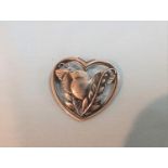 A silver Georg Jensen brooch numbered 239, bird on olive branch inside heart border marked 925
