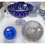 A modern blue overlaid fruit bowl on pedestal, diameter 10"; a spherical spatter glass vase; a