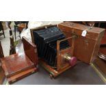 A 19th century mahogany and brass half plate folding camera by Adams & Co Ltd, with 3 plate