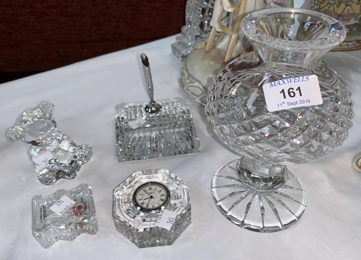 A Waterford Crystal candle lamp, height 7.5"; 4 other pieces: clock/paperweight; pan stand; teddy