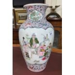 A Chinese porcelain baluster shaped vase decorated in colour enamels with genre scenes