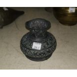 An Indian squat copper vase with relief decoration, height 9cm