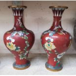 A pair of Chinese Cloisonne red grand vases with floral decoration